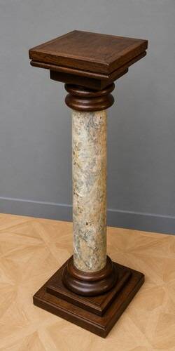 Column-shaped pedestal, made of solid wood and faux marble paint.