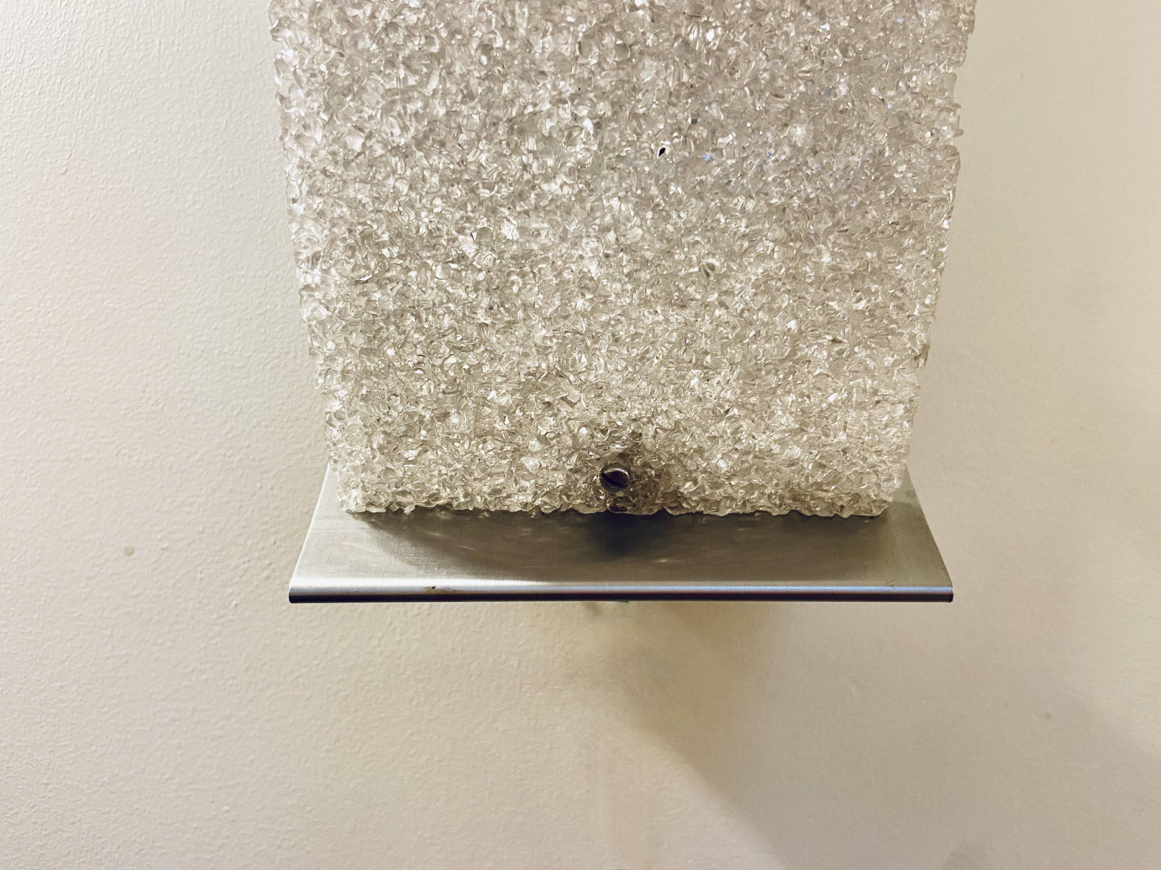 Pair of brushed steel and perspex wall lights, circa 1970.