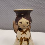 Ceramic candle holder, in the shape of an angel, signed at the bottom.