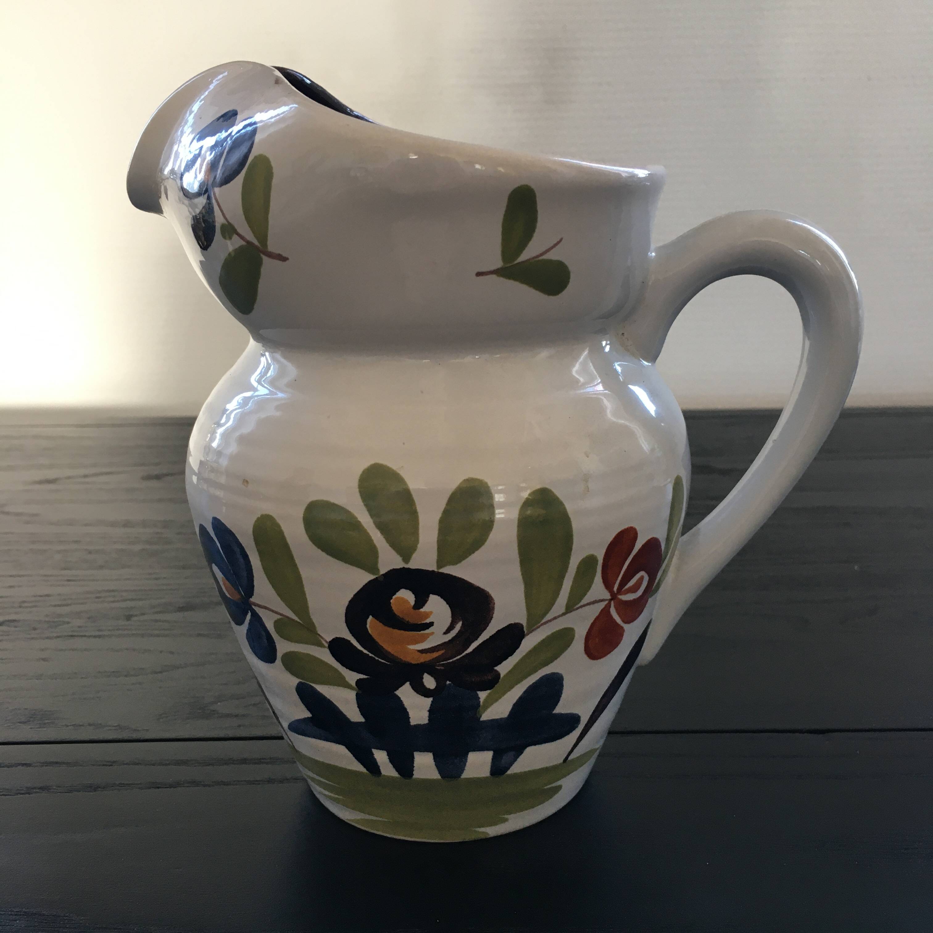 White pitcher with floral decoration