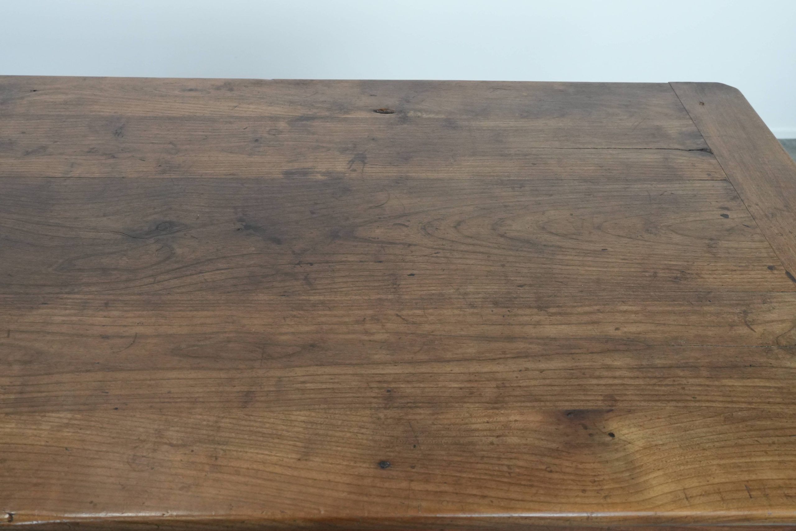 Antique French farmhouse dining table with two drawers and a pull-out board