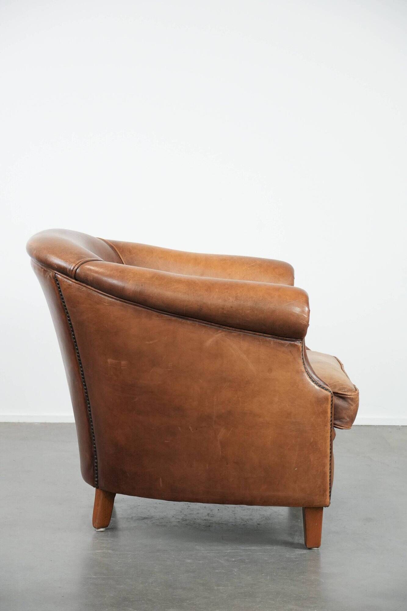 Comfortable club chair made of sheepskin leather