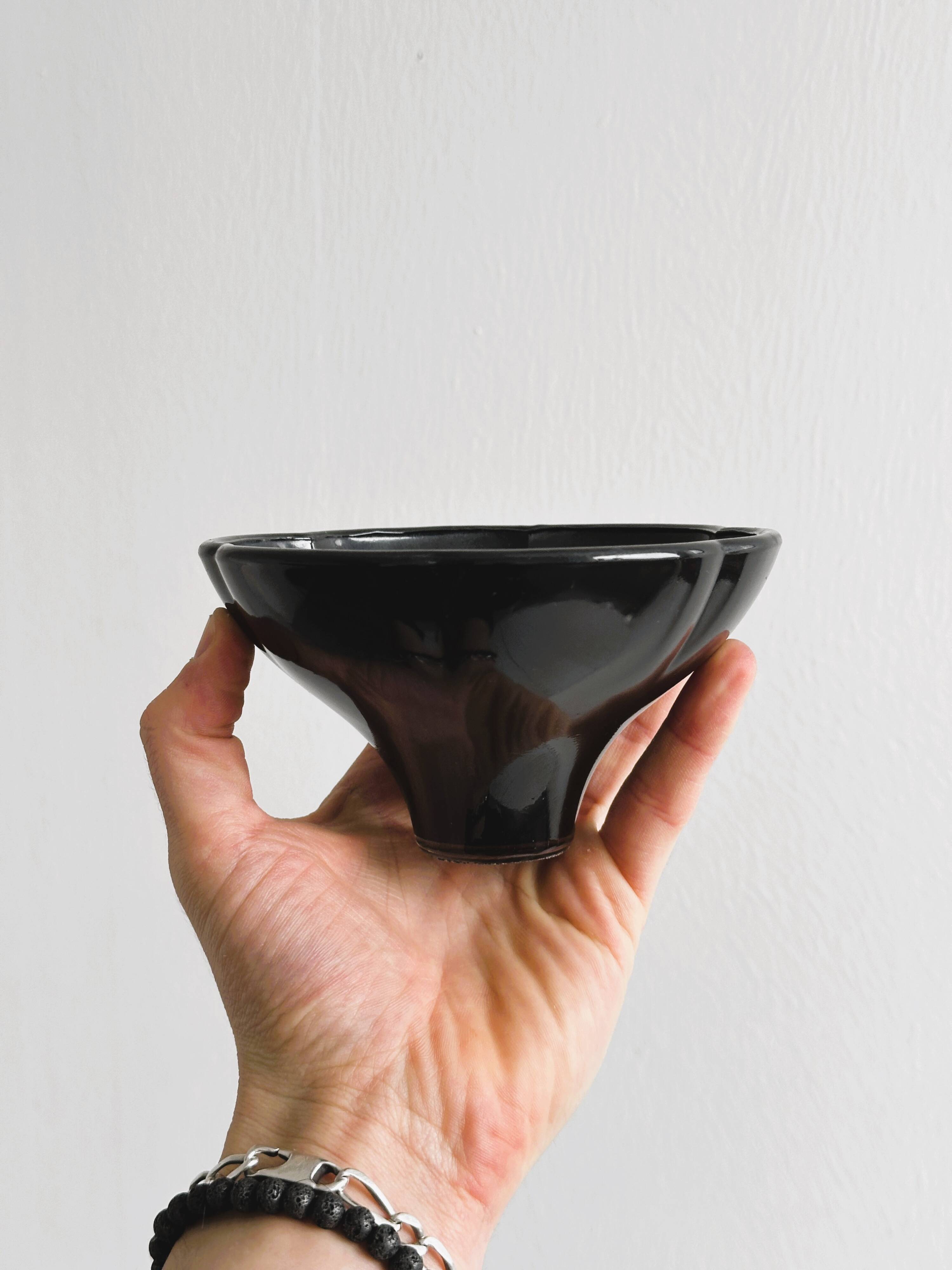 Small black glass cup