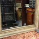 Mirror in a frame with a moulding.
