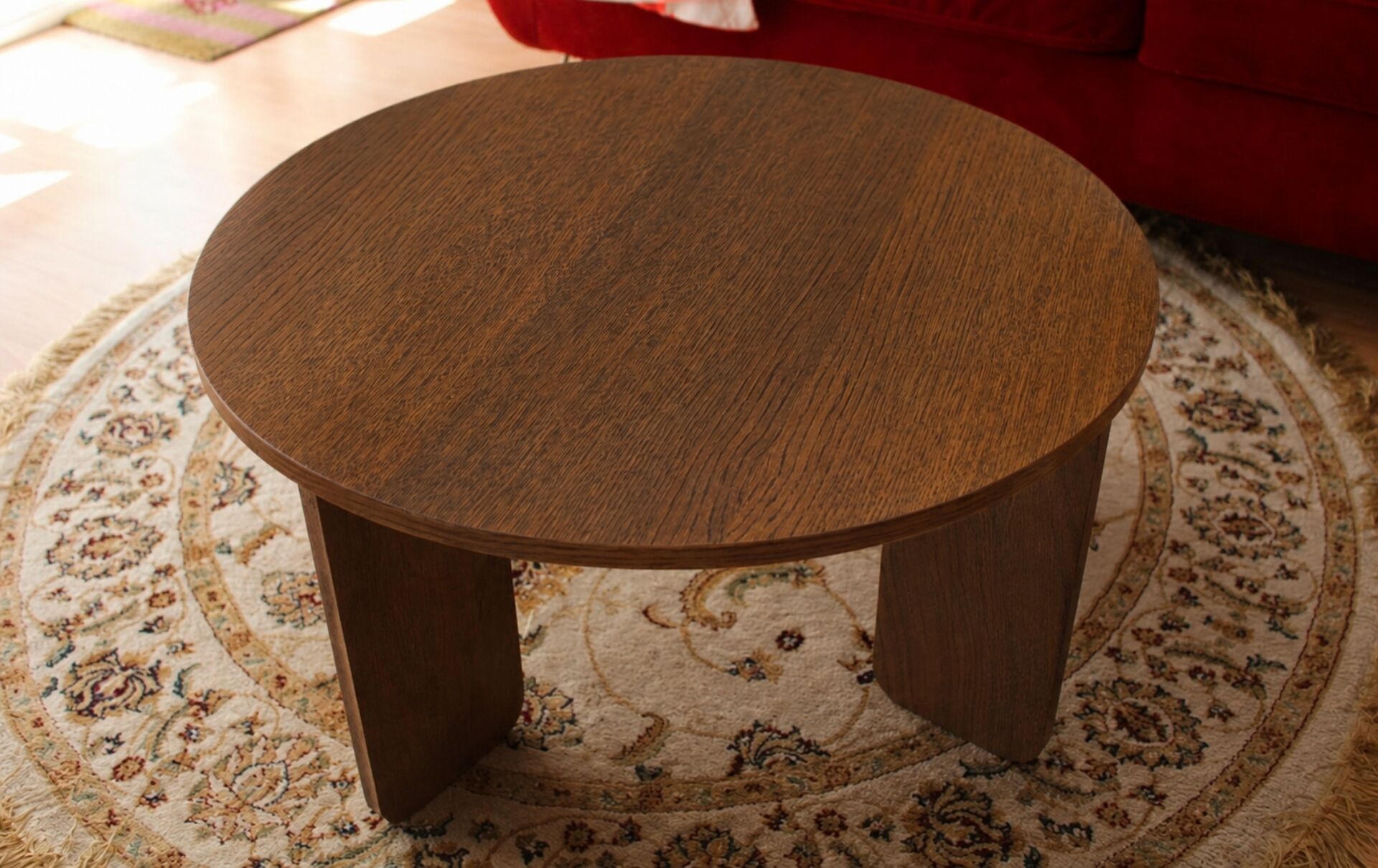 Round table in dark oak veneer