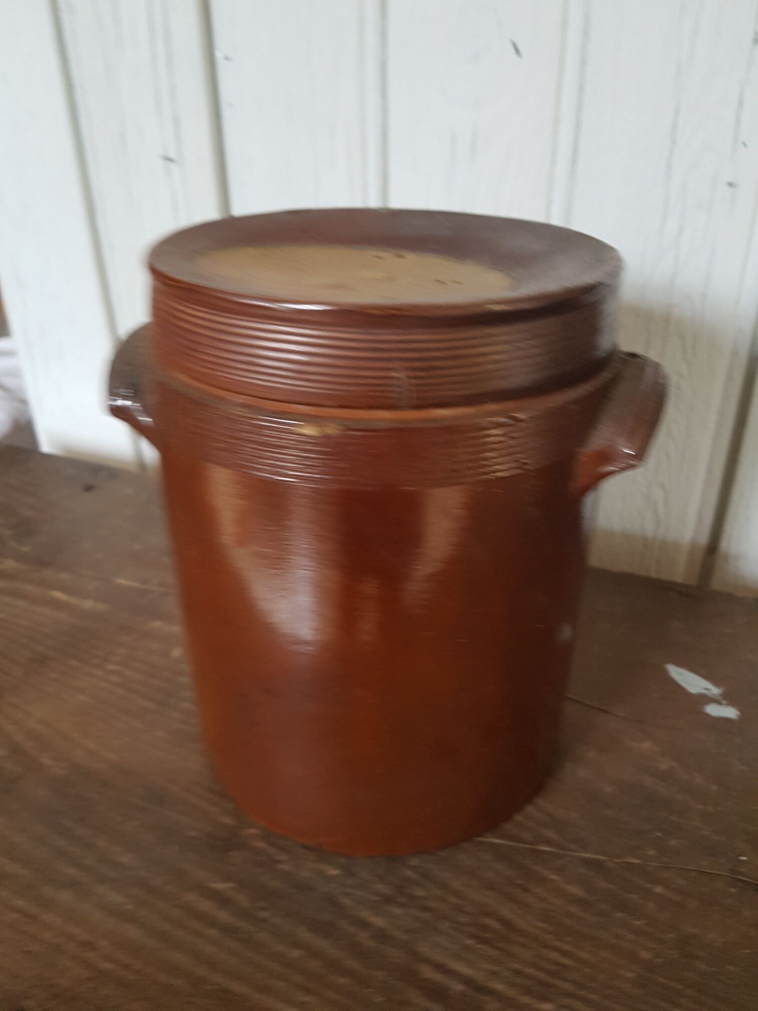 Old sandstone pot with lid