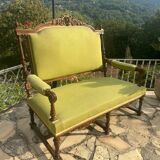 Richly carved solid wood bench in Louis XVI style.