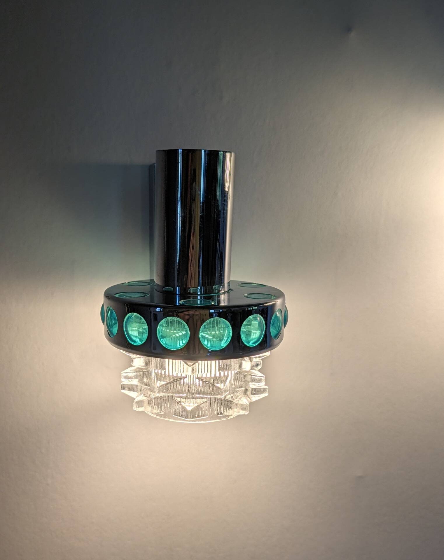 Pair of Space Age wall lights in chrome and green glass, 1970s.