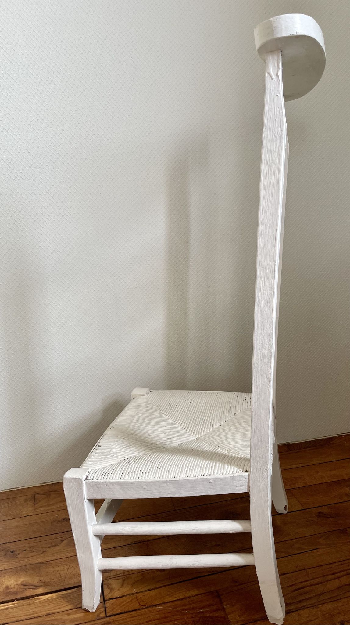 Old white mulched wooden chair