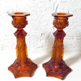 Pair of amber glass torches decorated with gothic motifs