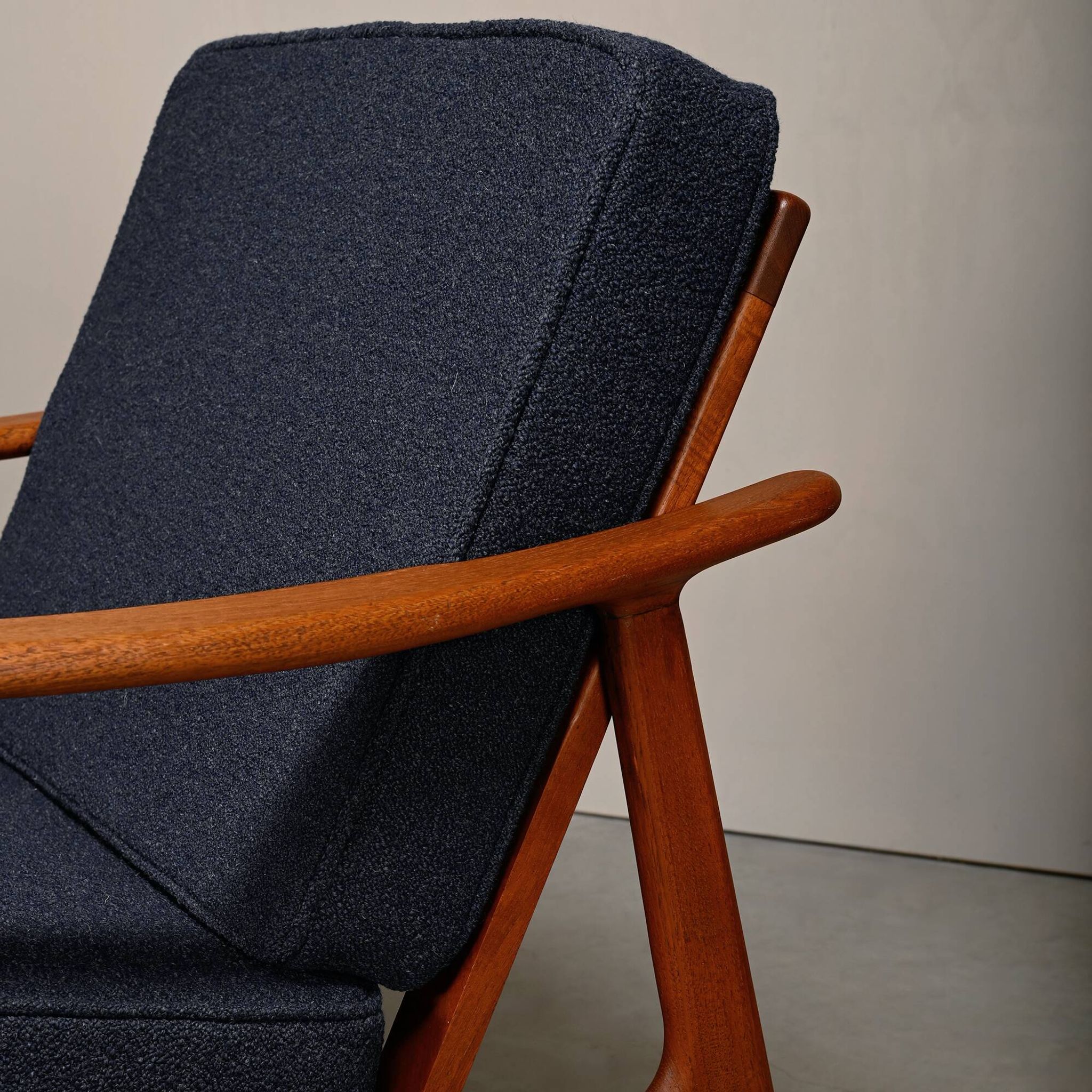 Pair Scandinavian Modern armchairs in teak and dark blue bouclé fabric