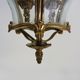Old lantern with 3 faces, chandelier in gilded bronze and curved glass. Year 60