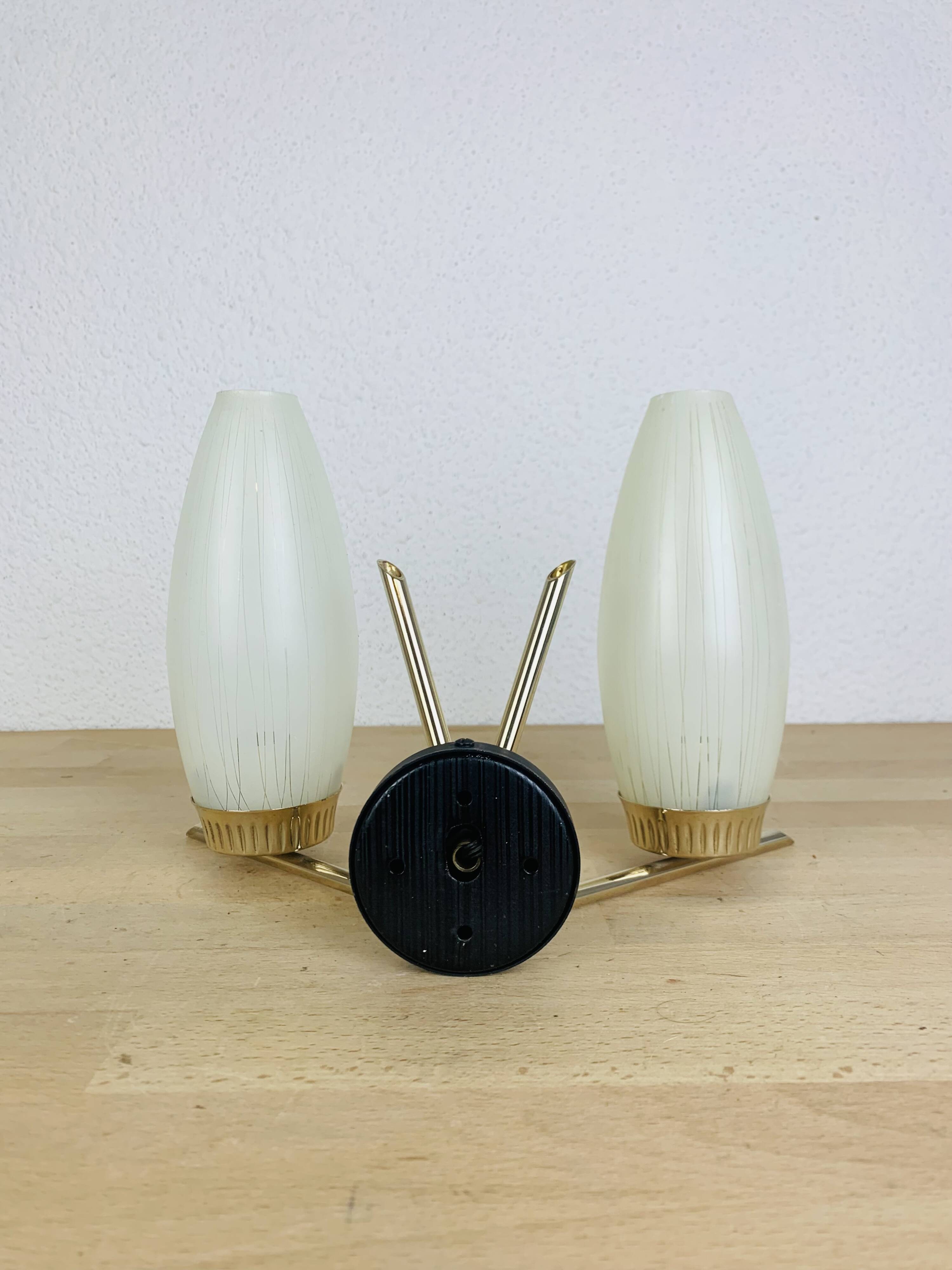 50s double-light wall light, brass and black metal, opaline tulips