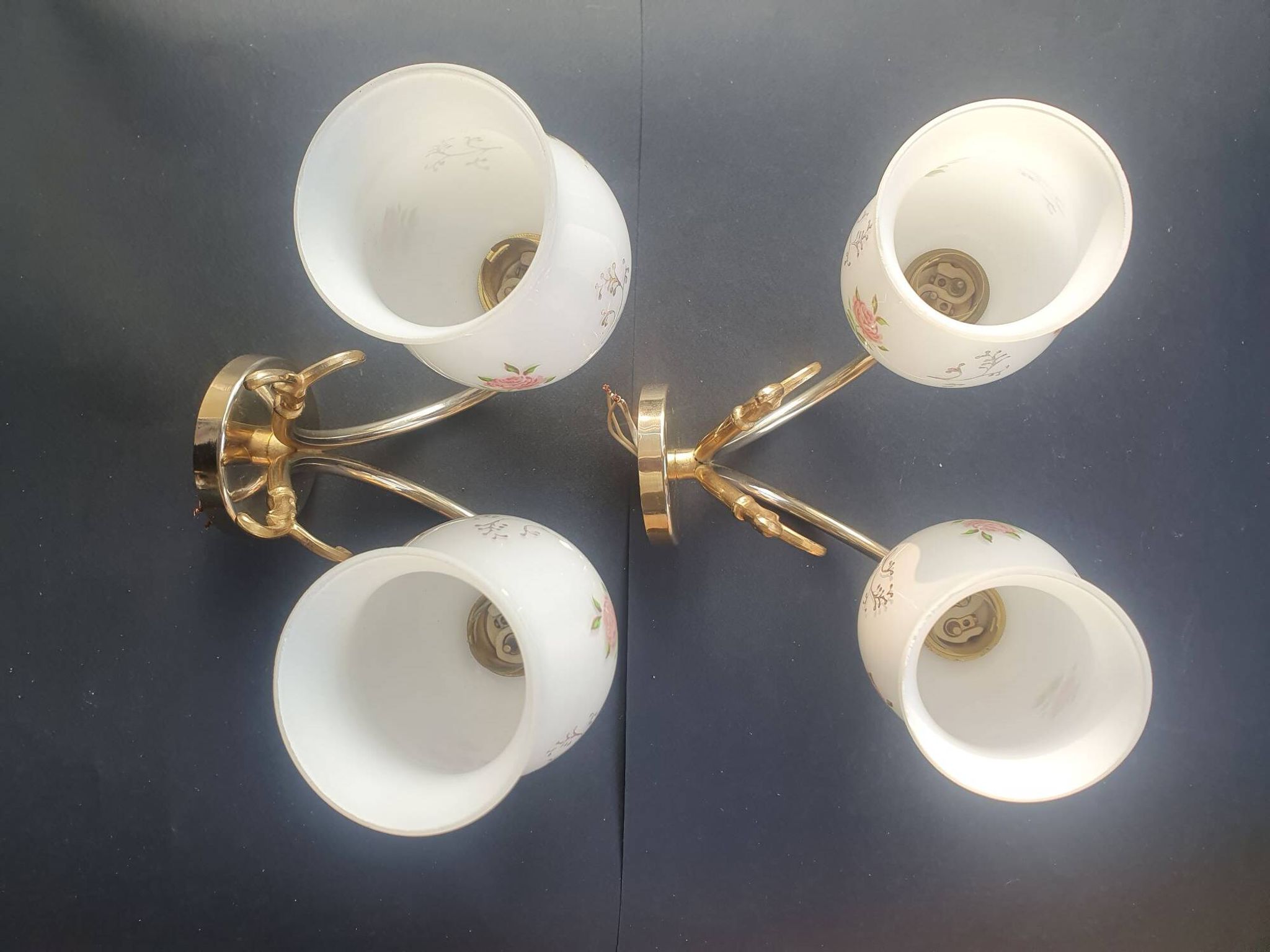 Pair of vintage wall sconces in gilded brass and pink opaline glass.