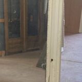 Louis XVI style mirror in wood and patinated stucco 20th century