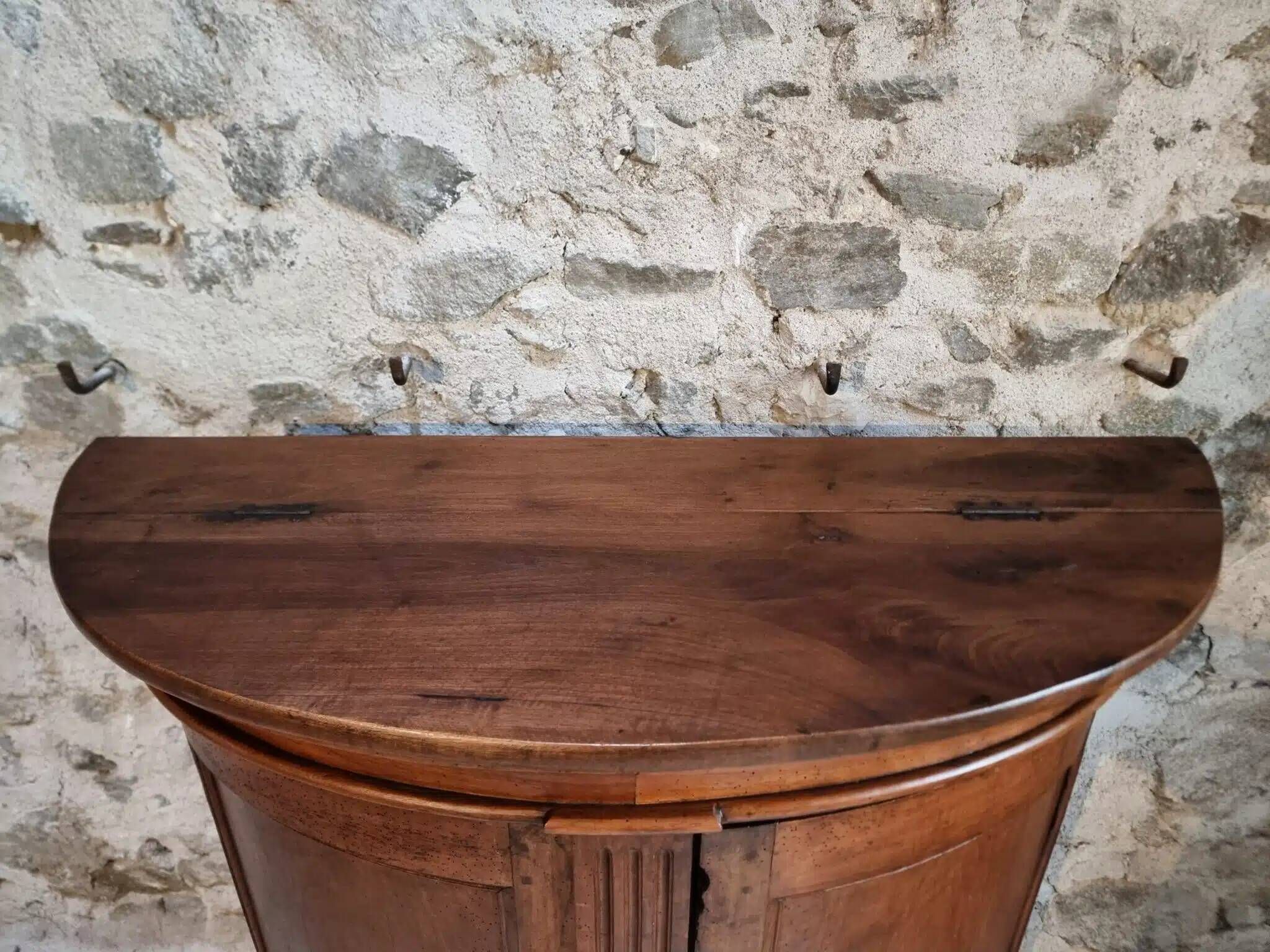 Antique demi-lune cabinet in walnut, late 18th century, French château.