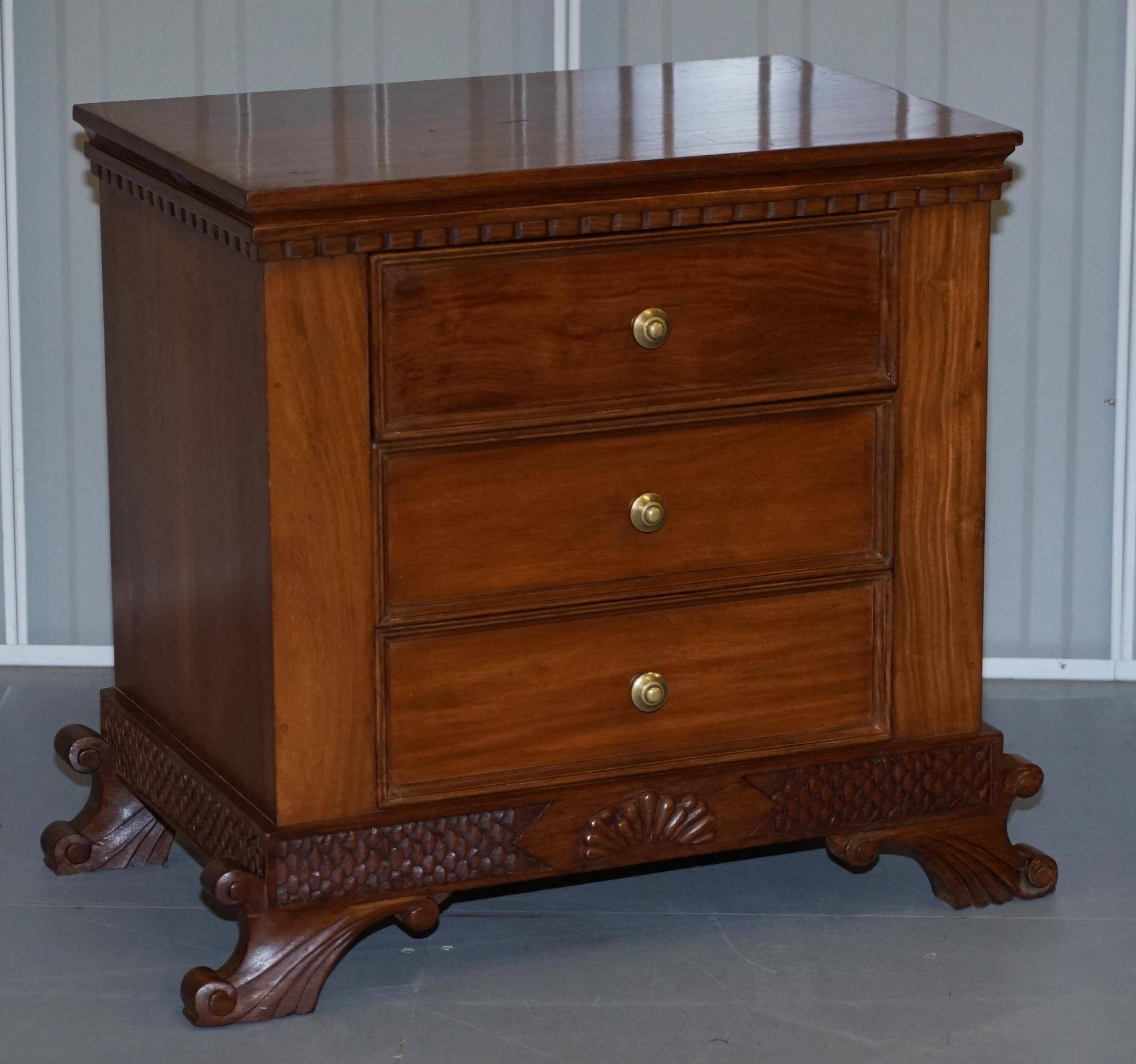 Set of hardwood dressers with finely carved bases.