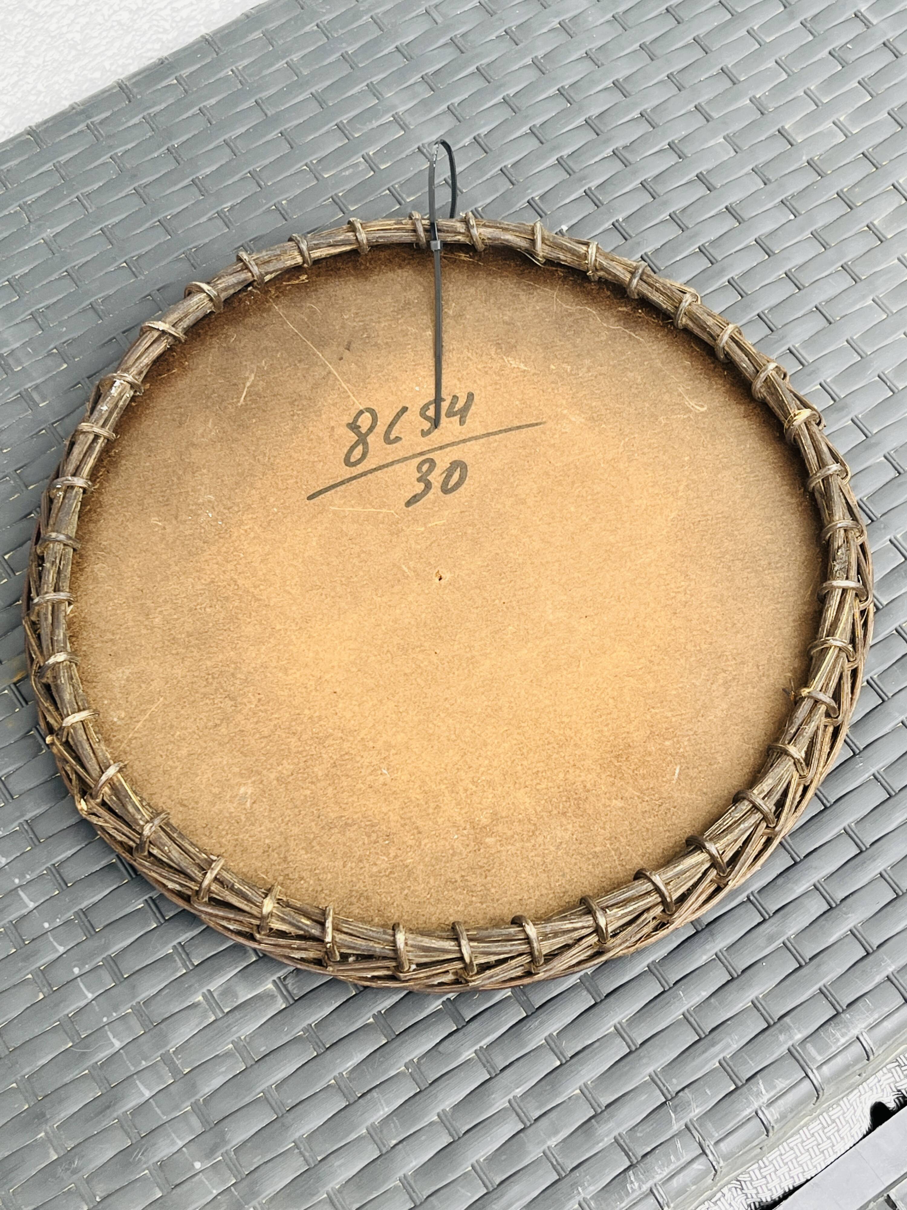 Vintage sun mirror in woven wicker