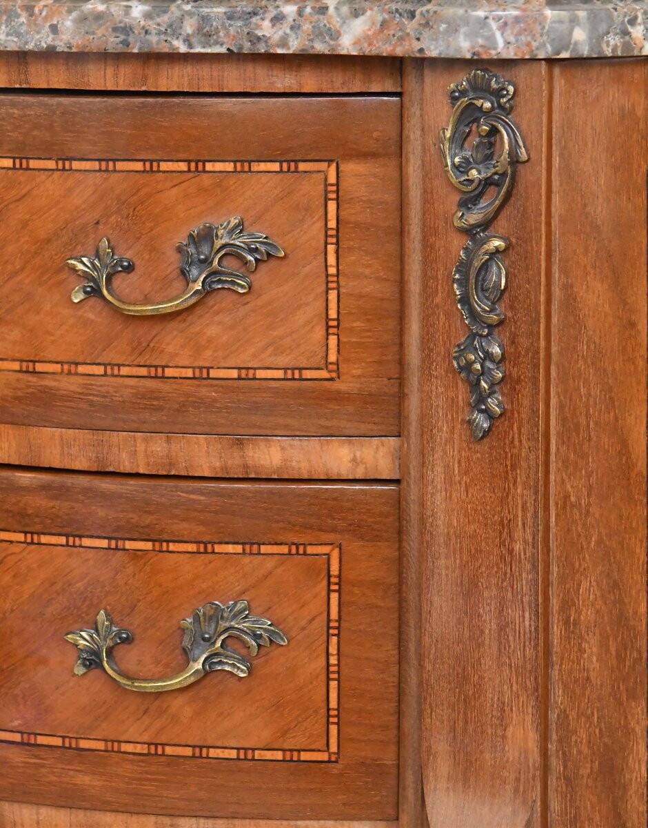 Small kidney-shaped chest of drawers in Transition style.