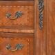 Small kidney-shaped chest of drawers in Transition style.