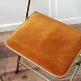 Two gold velvet folding chairs