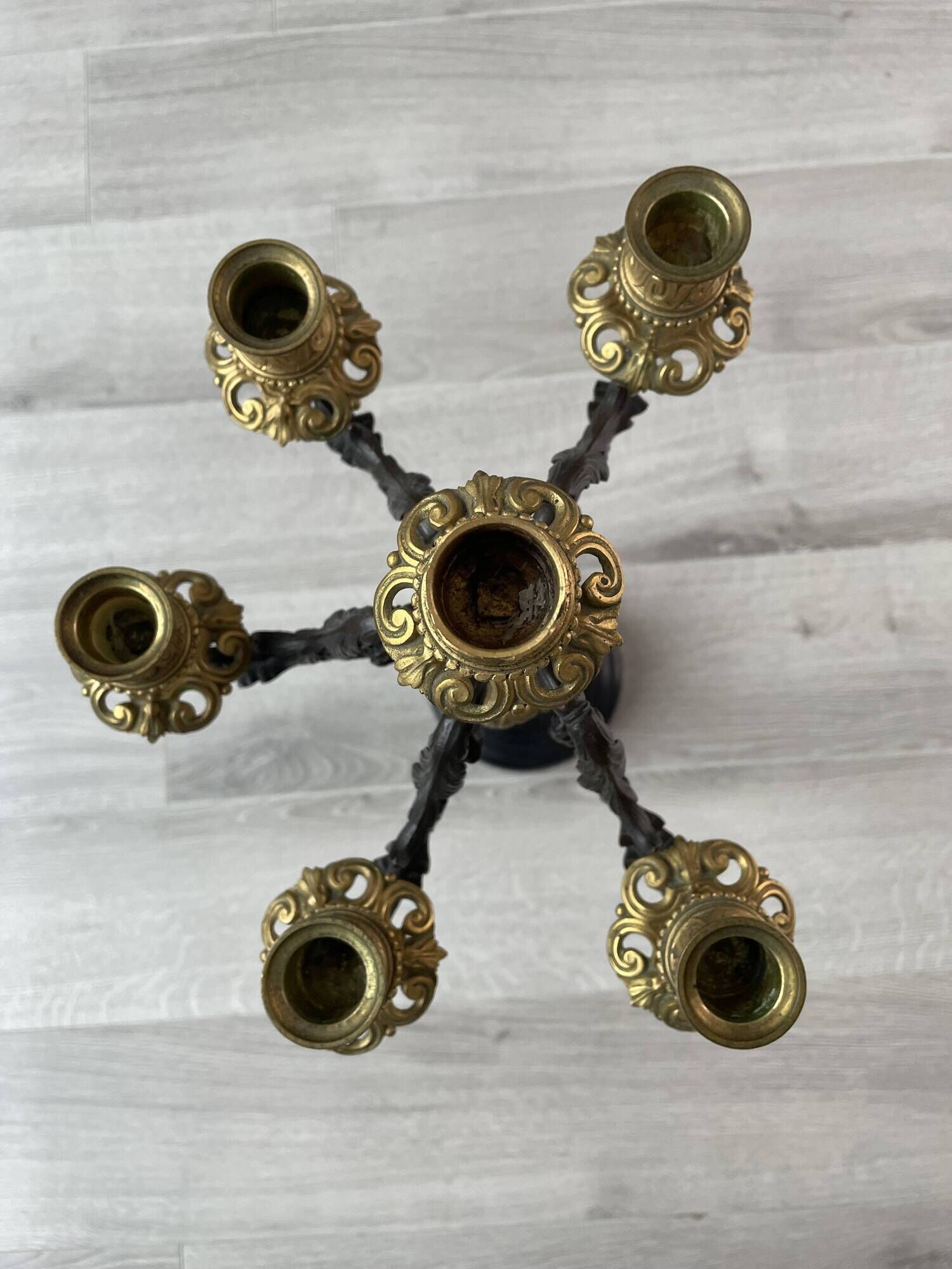 Candelabra with cherub in patinated bronze