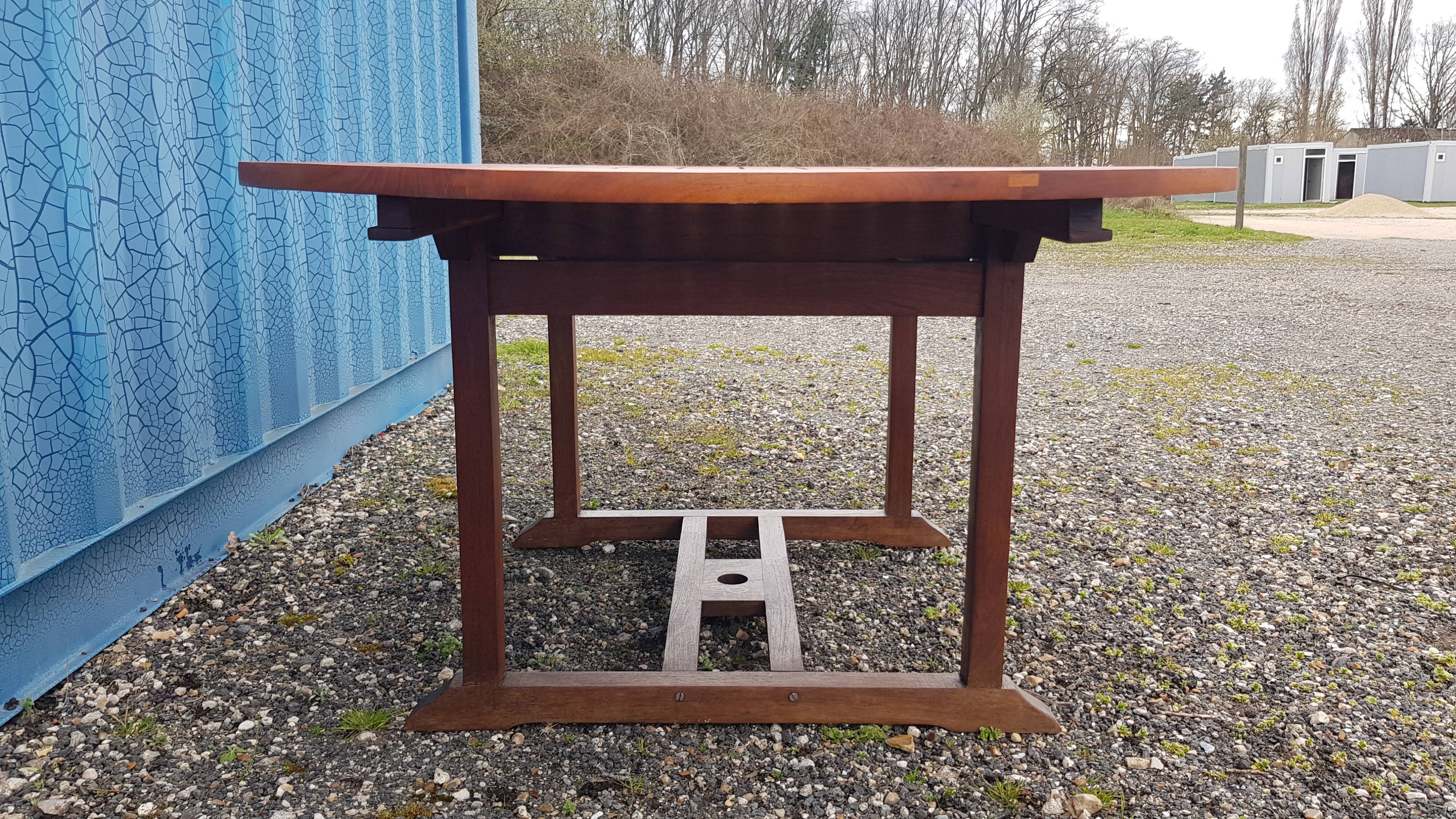 Stretchable garden dining table in solid teak