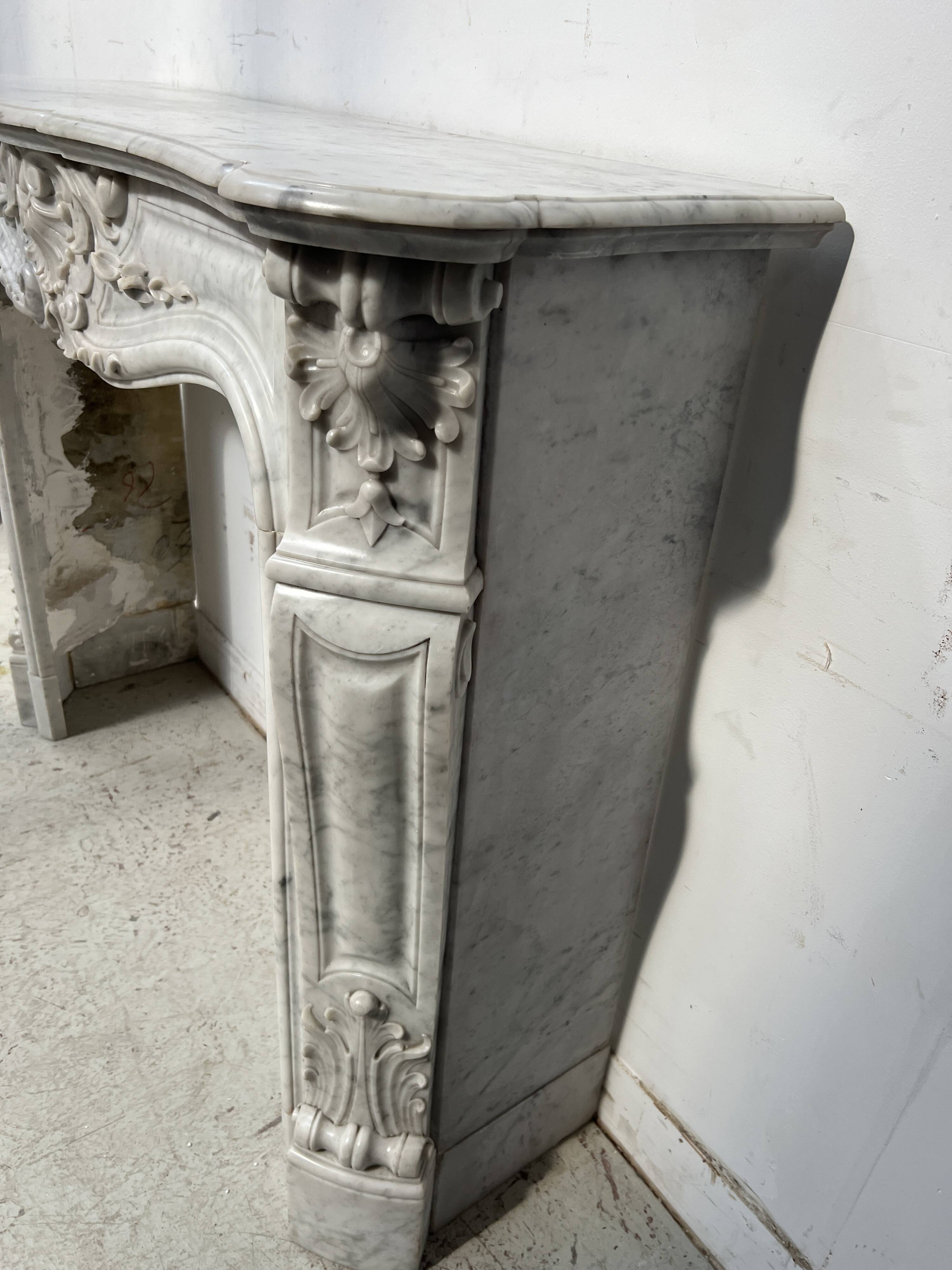 Louis XV style white Carrara marble fireplace, 19th century.