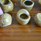 Lot of 12 enamelled sandstone snail shells