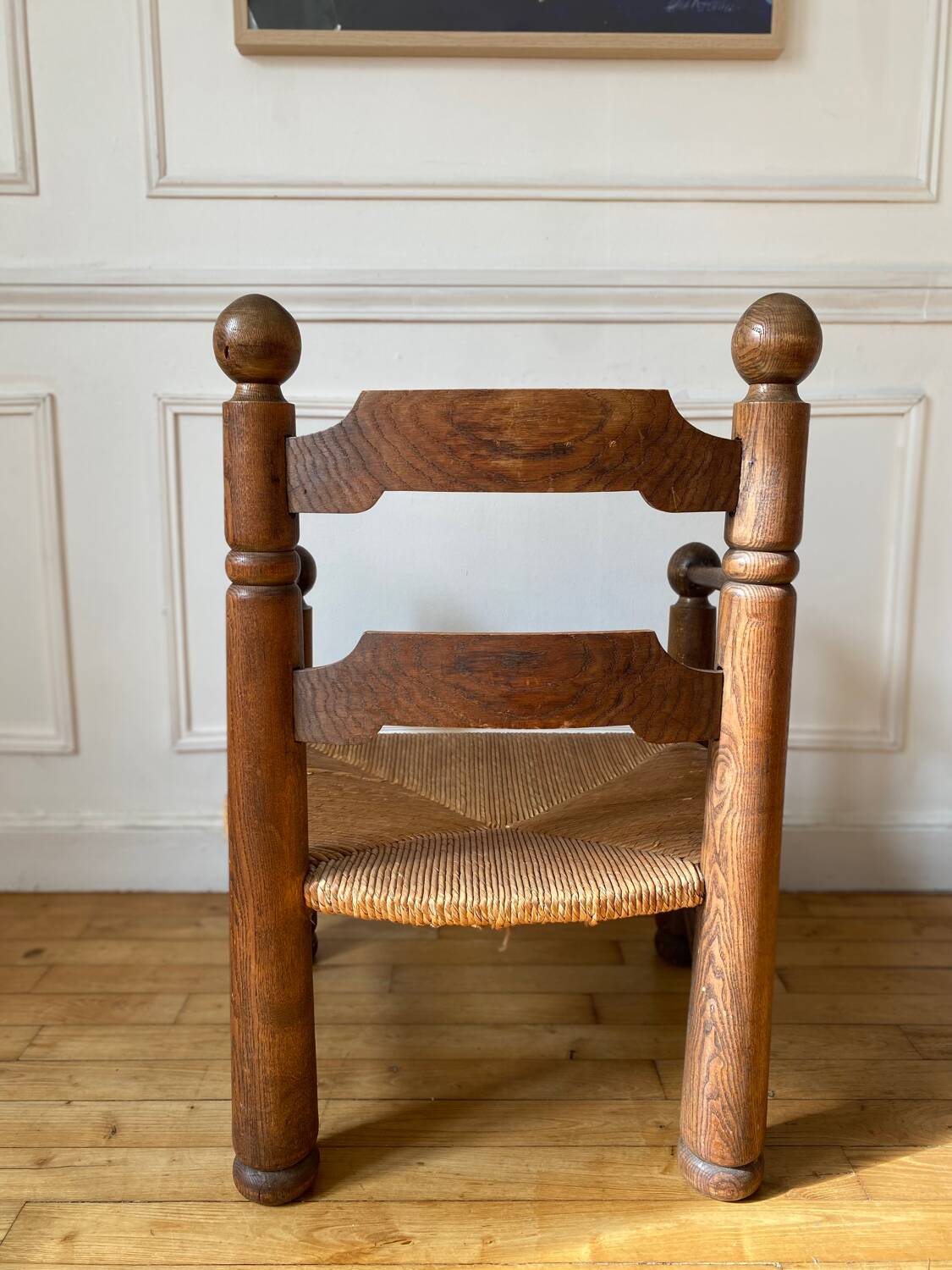Straw and turned wood fireplace armchair in the style of Charles Dudouyt