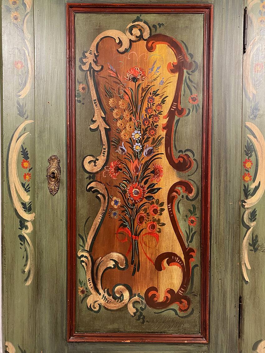 Alsatian bonnet maker in painted softwood with floral decorations