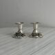 Pair of vintage metal candlesticks with a grape pattern.