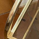 Gold metal and smoked glass console table.