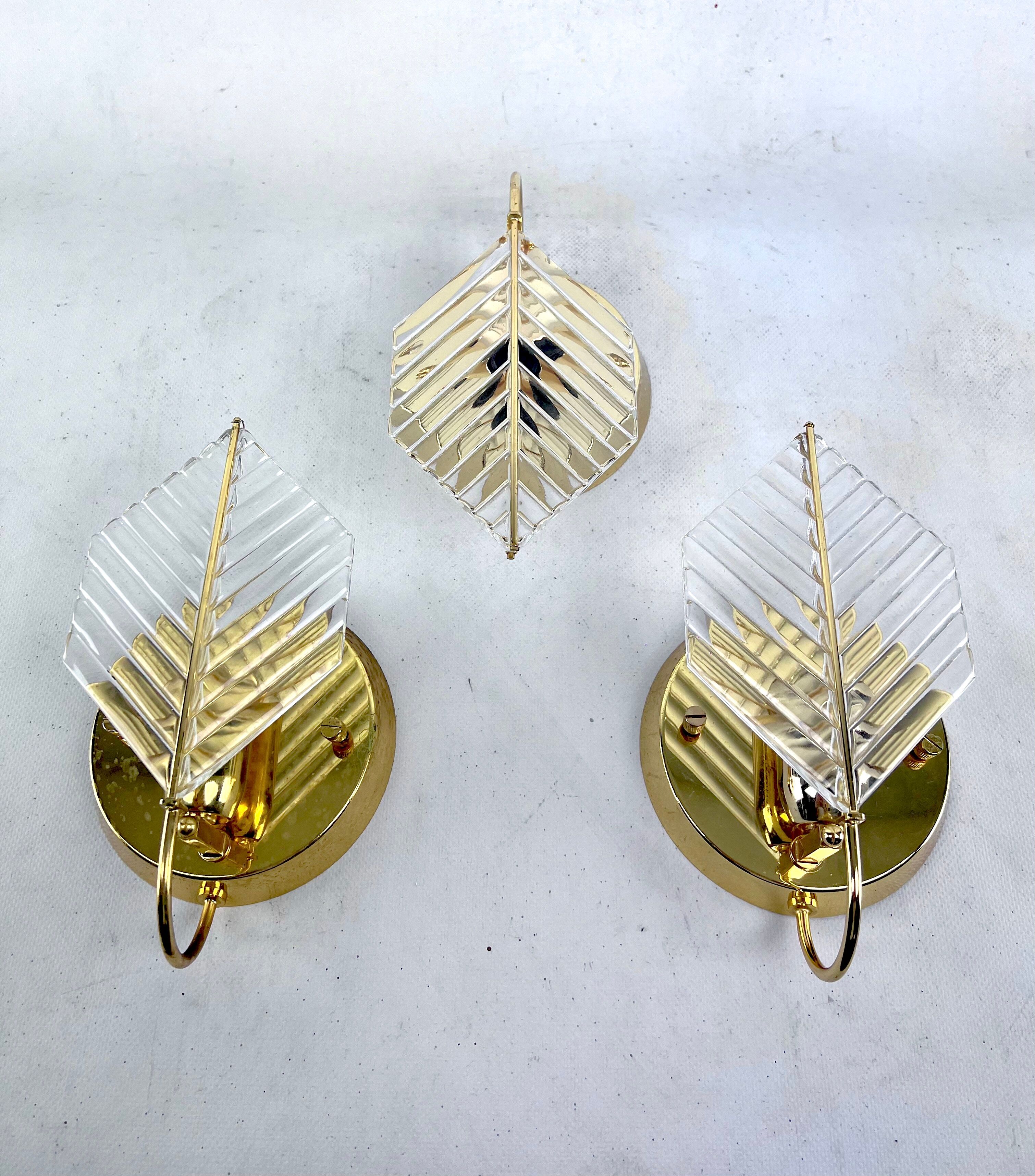 Vintage set of three sconces in brass and glass by Zero Quattro. Italy 1970s