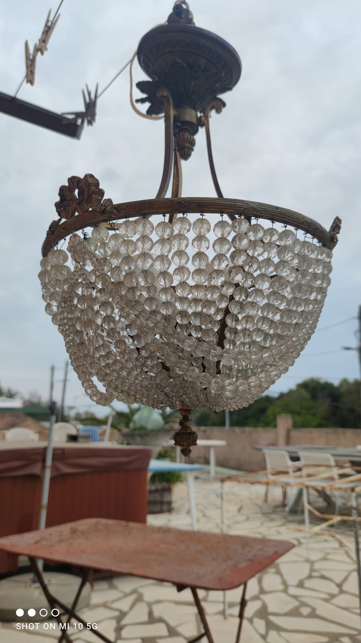 Antique bronze and crystal chandelier, formerly gas-powered, dating from the late 19th century.