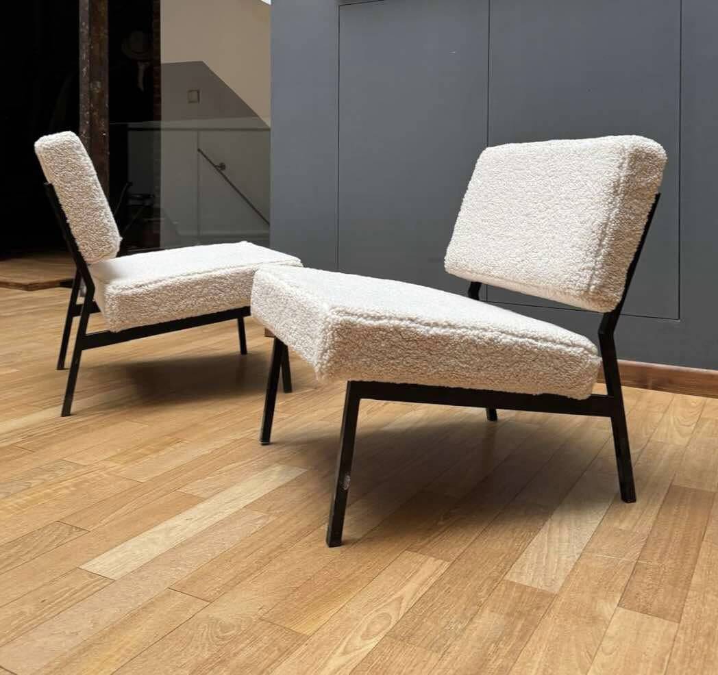 Pair of vintage armchairs, black metal and sheepskin fabric, France 1950.