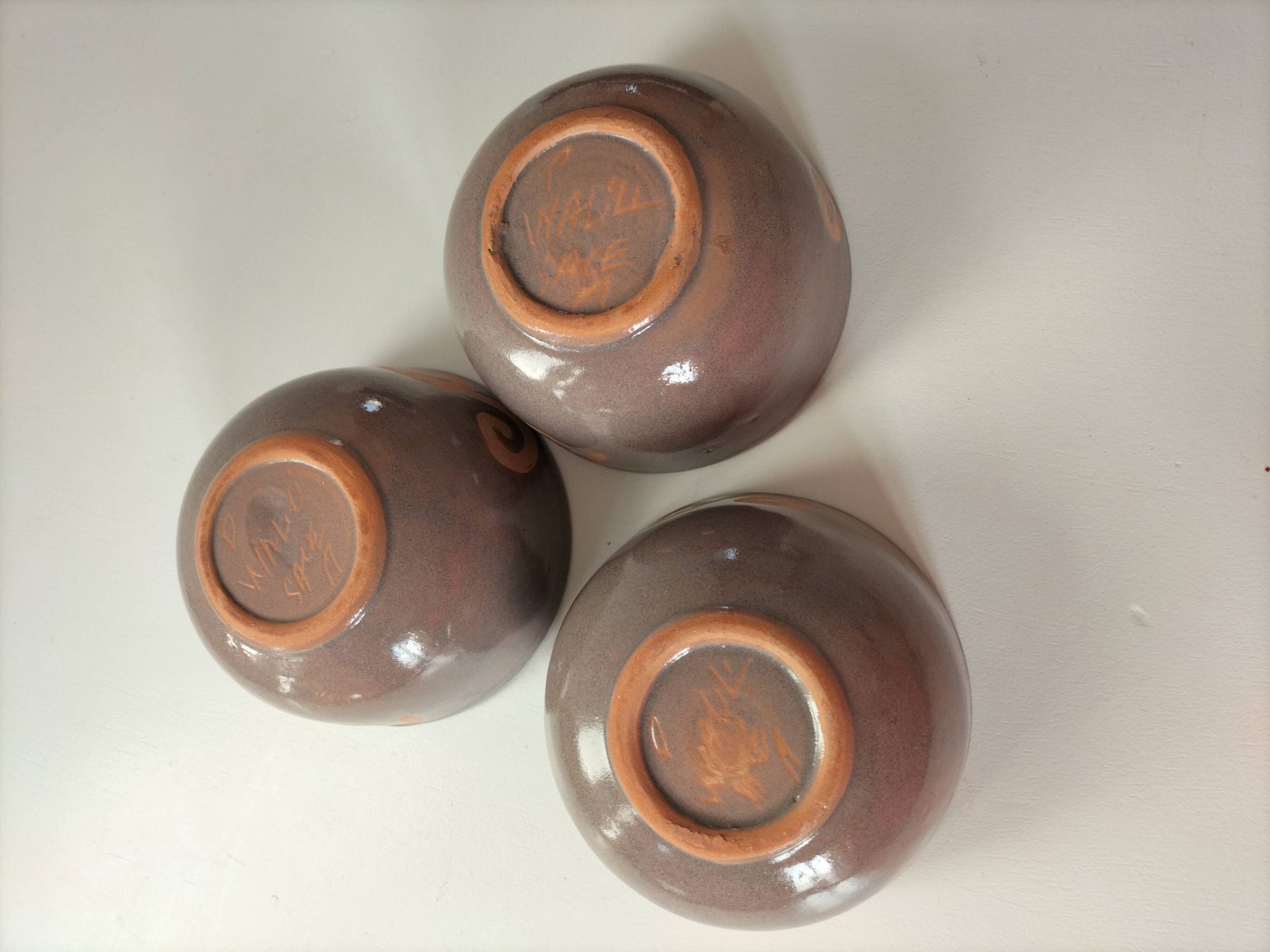 Set of 3 signed glazed stoneware bowls
