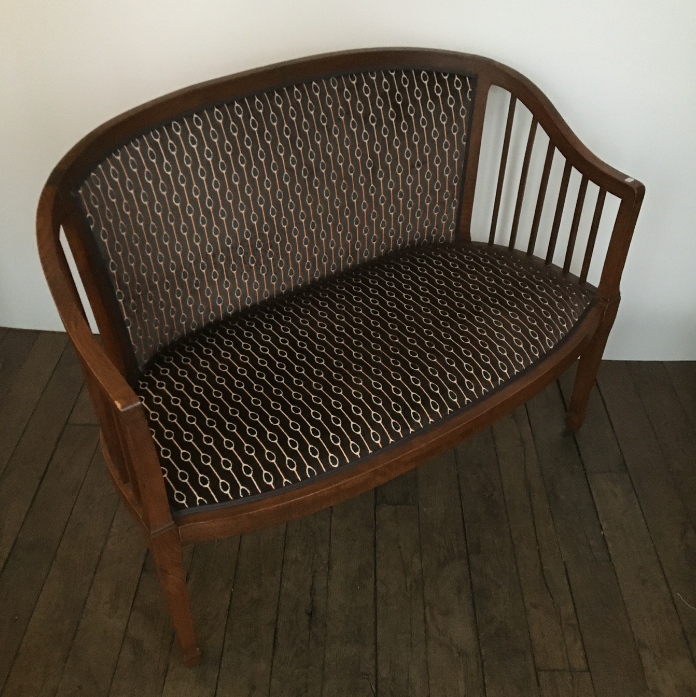 Old wooden and velvet bench