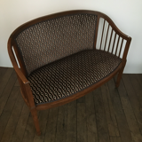 Old wooden and velvet bench