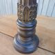 2 carved wooden candlesticks
