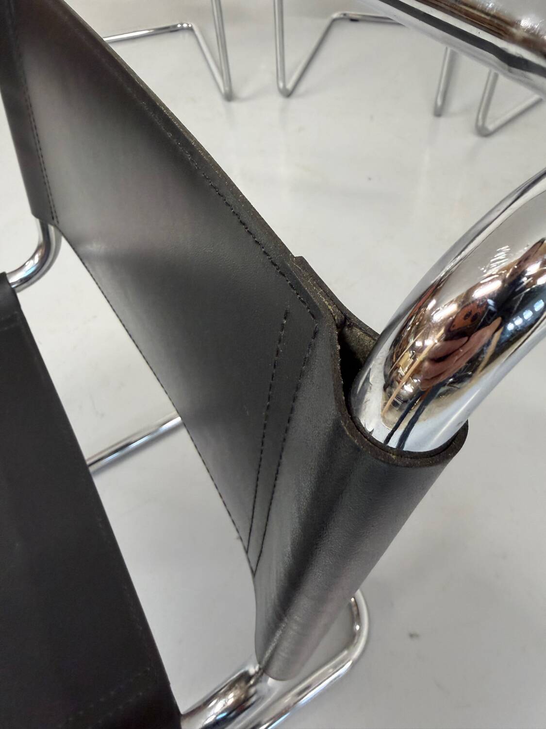 Lot of 4 tubular chairs designed by Mart Stam in vintage black leather from the 1980s.