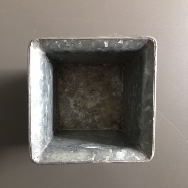 Galvanized flowerpot with ivy decor