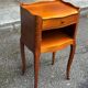 2 bedside tables in transitional or Louis XV style, made of curved solid wood with drawers.