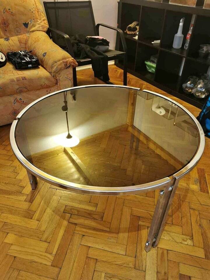 Mid-century round coffee table in silver chrome with a glass top — 1960s