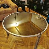 Mid-century round coffee table in silver chrome with a glass top — 1960s