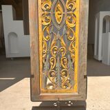 Rectangular Indonesian construction element with blue and yellow plant in carved wood