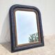 Antique mirror in Napoléon III style, blackened with beaded frieze, 42x55cm.