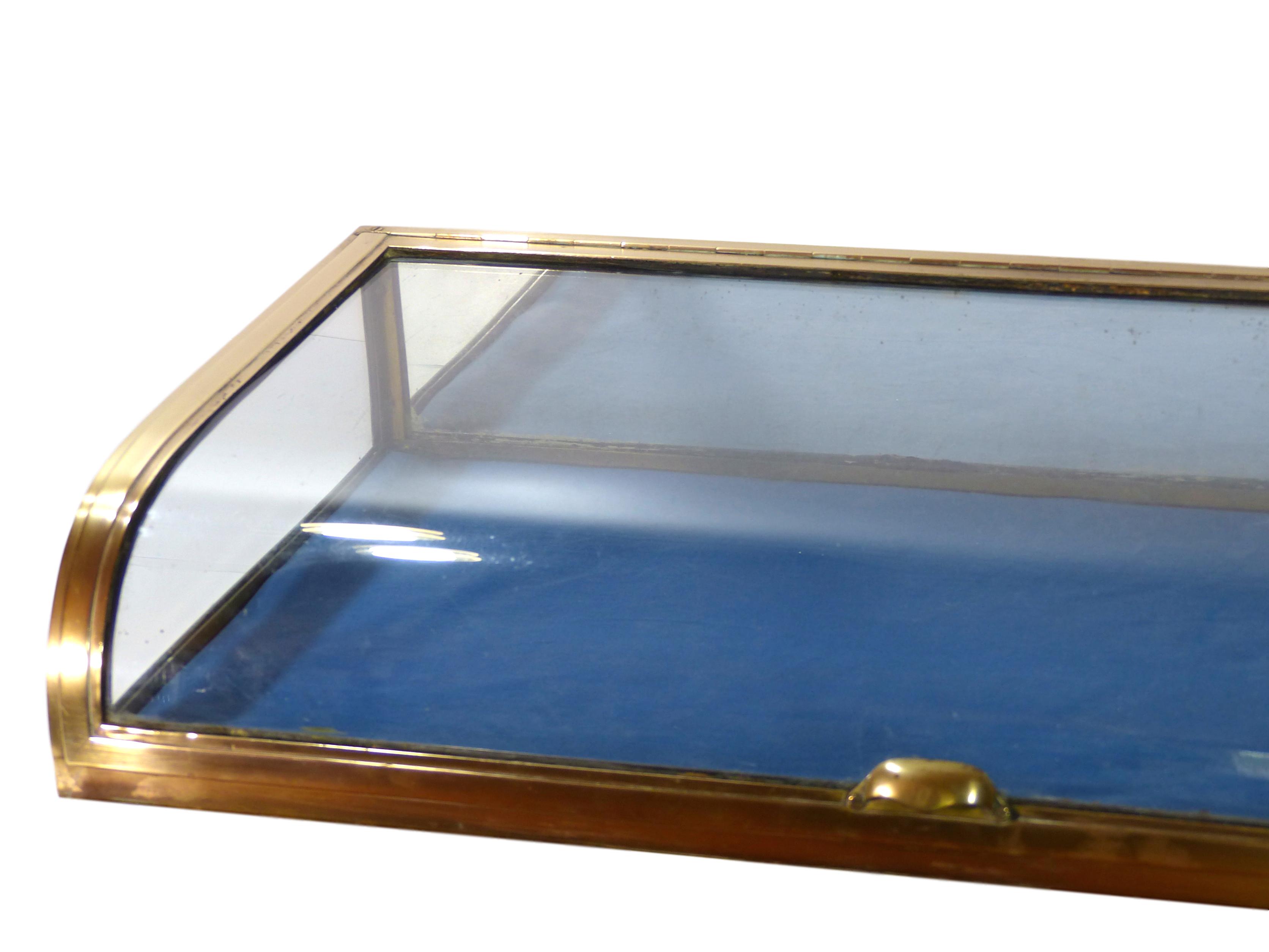 Showcase glass dome and gilded brass