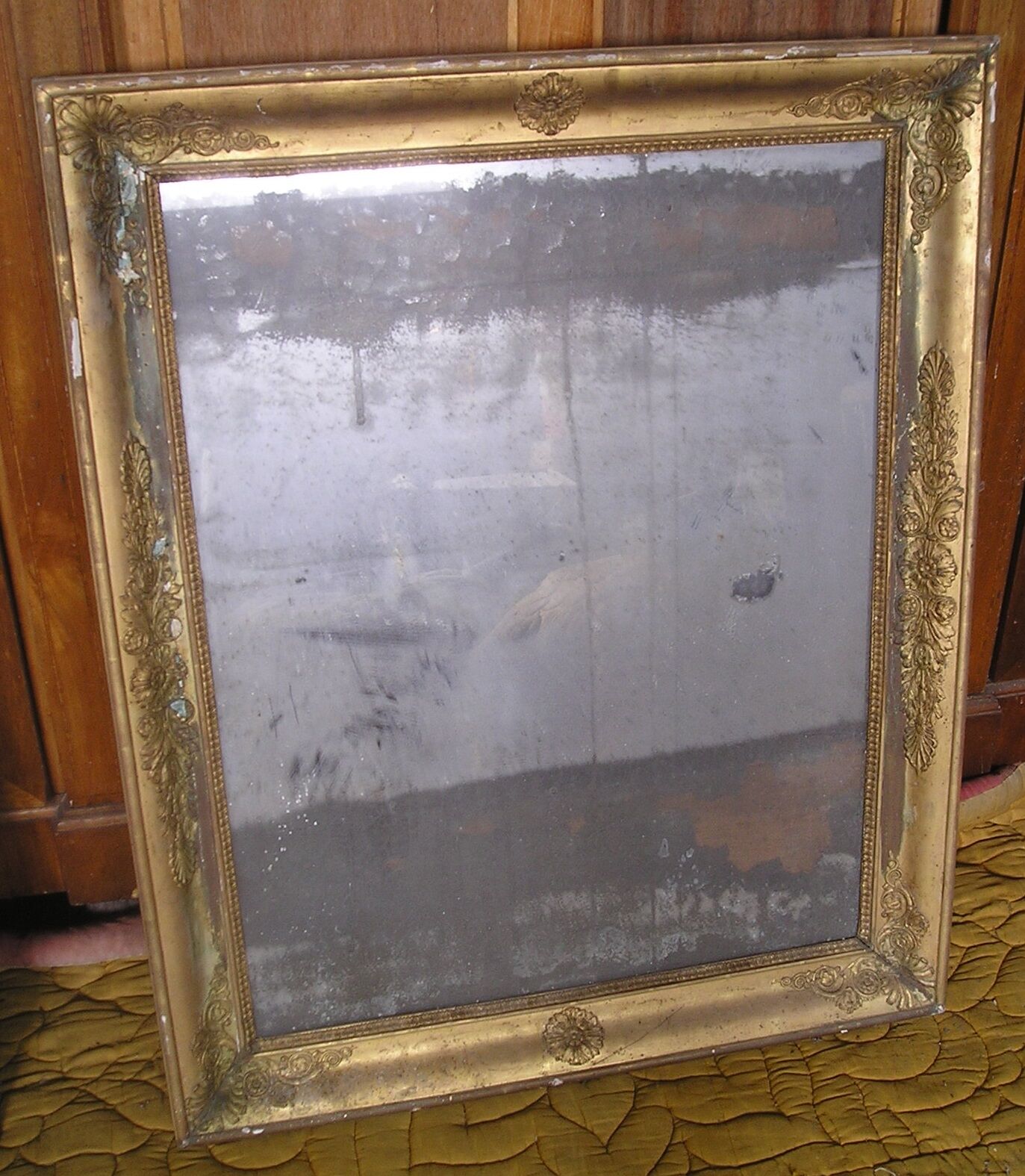 Antique wooden mirror and gilded stucco with gold leaf 89 x 72