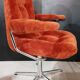Orange velvet swivel armchair